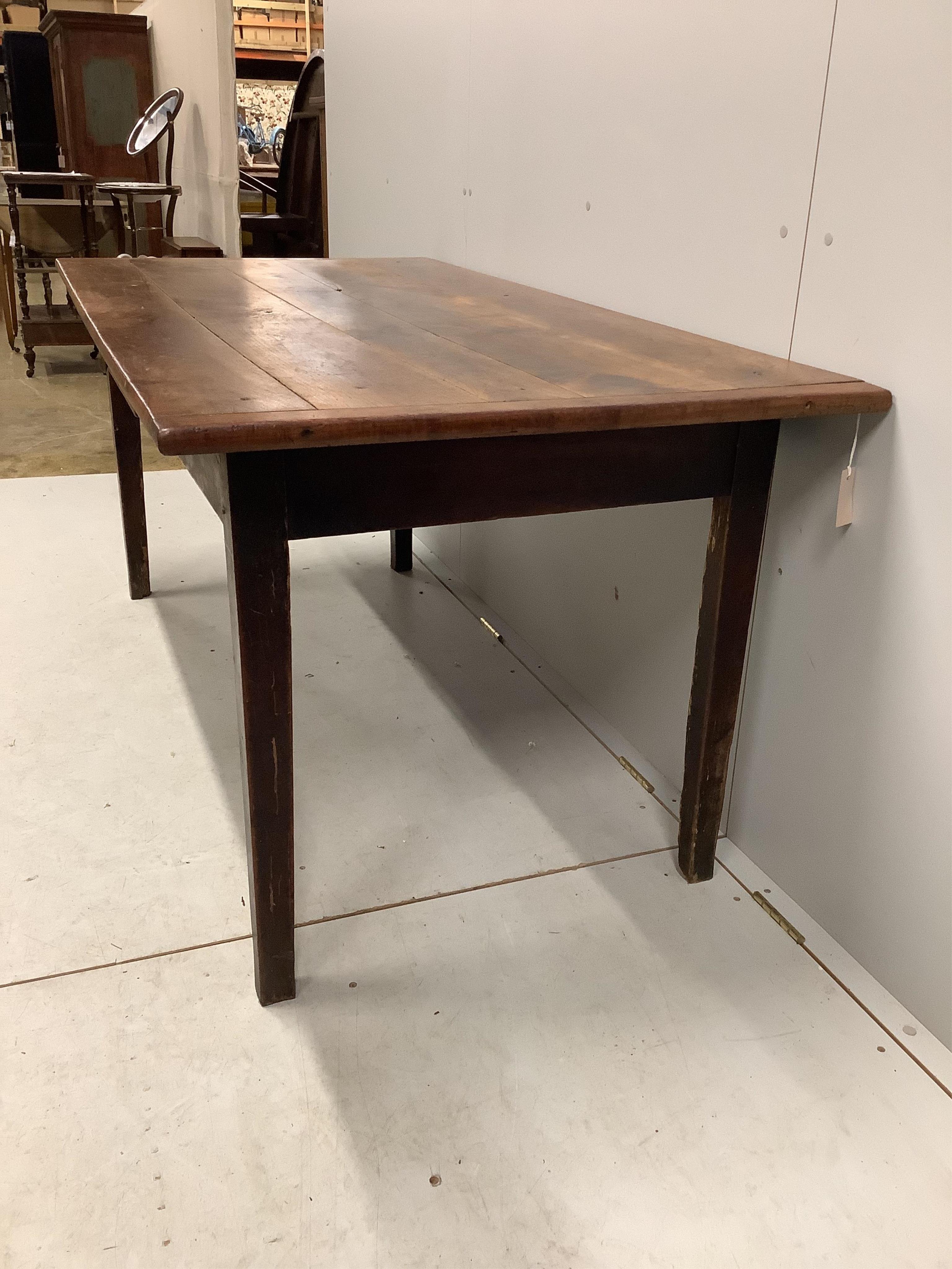 A 19th century French rectangular oak kitchen table, fitted drawer on square tapered legs, width 164cm, depth 83cm, height 72cm. Condition - fair, top with knot hole, all legs have losses due to old worm infestation, now